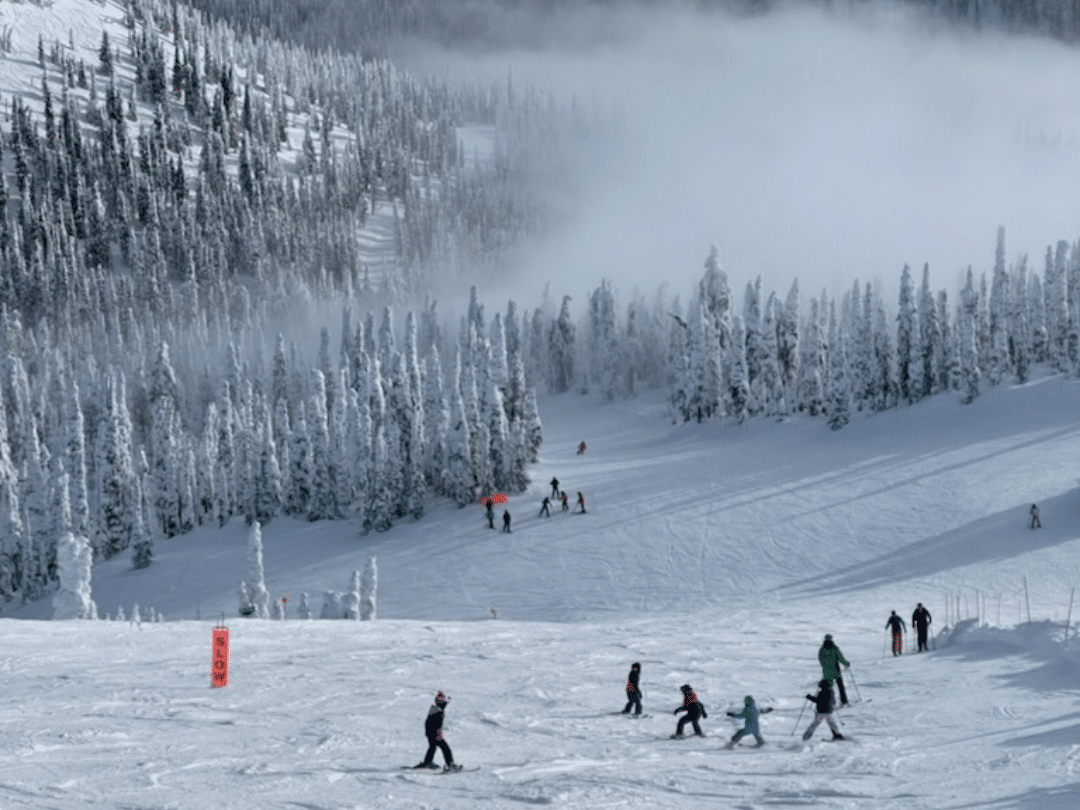 people skiing at whitefish mountain resort